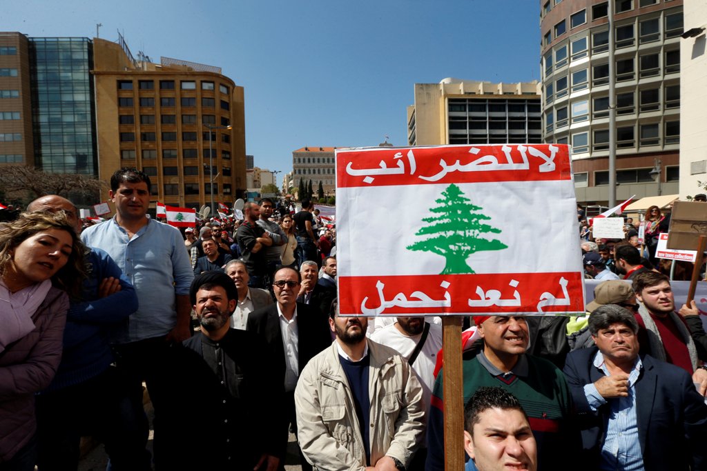 Protesters take part in a demonstration against a proposed tax increase, in front of the government palace in Beirut, Lebanon March 19, 2017. The placard reads in Arabic 