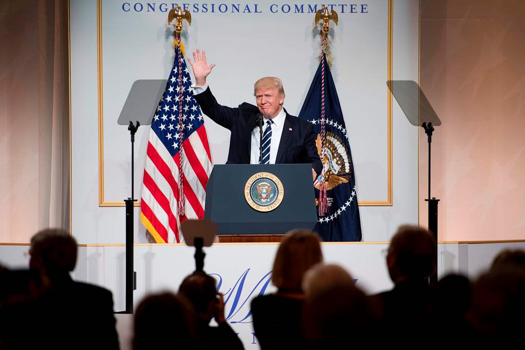 US President Donald Trump waves to the crowd as he arrives to address the annual National Republican Congressional Committee dinner in Washington, DC. AFP / JIM WATSON