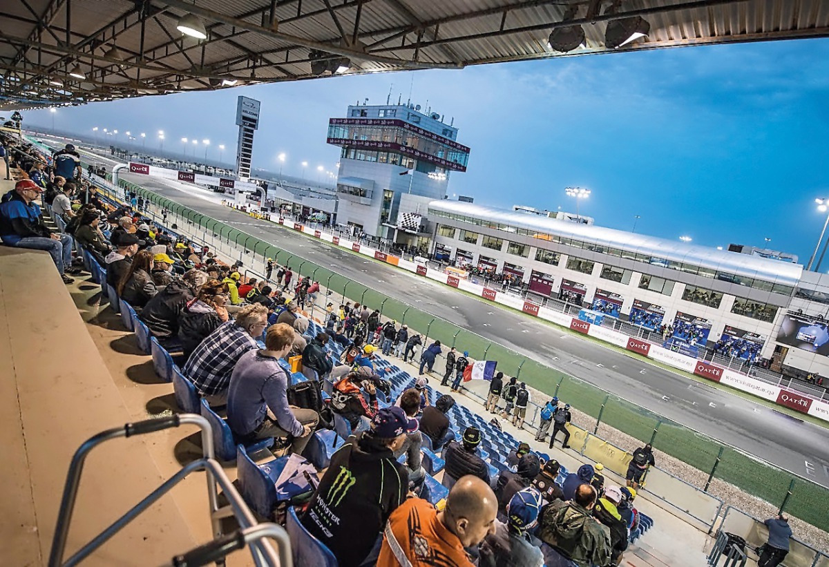 Spectators eagerly wait for till the start of MotoGP Qualifying rounds at the Losail International Circuit yesterday. Torrential rain yesterday afternoon wreaked havoc at the Grand Prix of Qatar, forcing the day's proceedings to be called off.