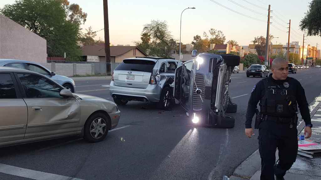 A self-driven Volvo SUV owned and operated by Uber Technologies Inc. is flipped on its side after a collision in Tempe, Arizona, U.S. on March 24, 2017. Courtesy FRESCO NEWS/Mark Beach/Handout via REUTERS