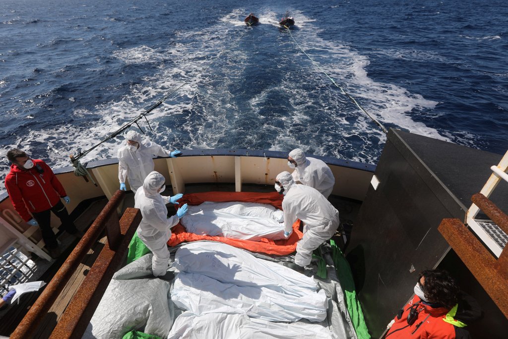 (file Photo) Lifeguards from the Spanish NGO Proactiva Open Arms sanitise five dead bodies of migrants on-board the former fishing trawler Golfo Azzurro following a search and rescue operation in central Mediterranean Sea off the Libyan coast, March 24, 2