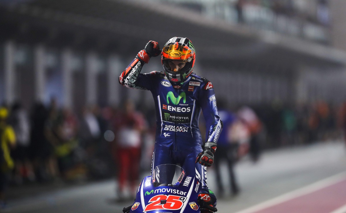 Movistar Yamaha MotoGP's Spanish rider Maverick Vinales celebrates after winning the 2017 Qatar MotoGP at the Losail International Circuit, north of the capital Doha on March 26, 2017. Spain's Maverick Vinales of Movistar Yamaha MotoGP won the season-open
