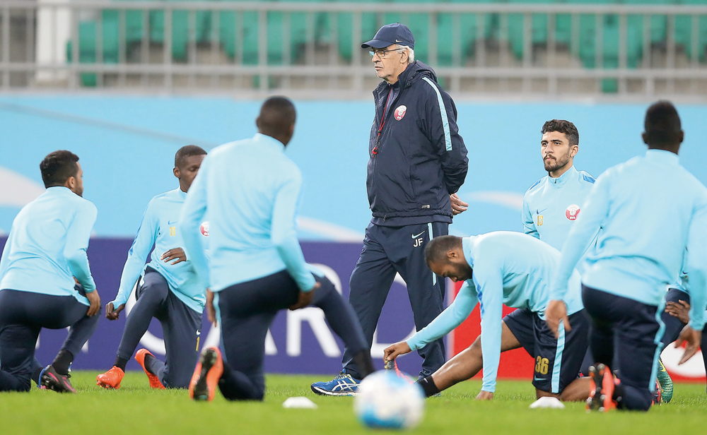 Qatar players training udner the watchful eyes of coach Jorge Fossati on the eve of the FIFA 2018 World Cup qualifying match against Uzbekistan in Tashkent.  