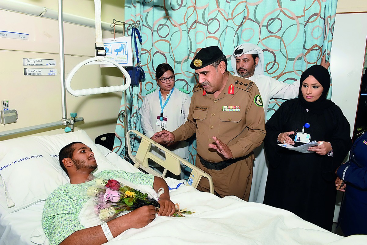 GCC traffic delegation visits an injured patient at Hamad General Hospital. 