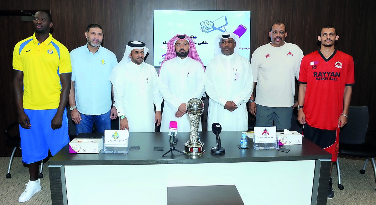 Qatar Basketball Federation  (QBF)Secretary General Ali Al Malki and  other officials pose for a photograph with Al Rayyan and Al Gharafa captains and coaches during a press conference held ahead of the final of the Qatar Cup Basketball Tournament. RIGHT: