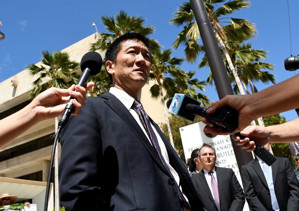Hawaii Attorney General Douglas Chin talks to the media at the US District Court Ninth Circuit after seeking an extension after filing an amended lawsuit against President Donald Trump's new travel ban in Honolulu, Hawaii, March 29, 2017. Reuters/Hugh Gen