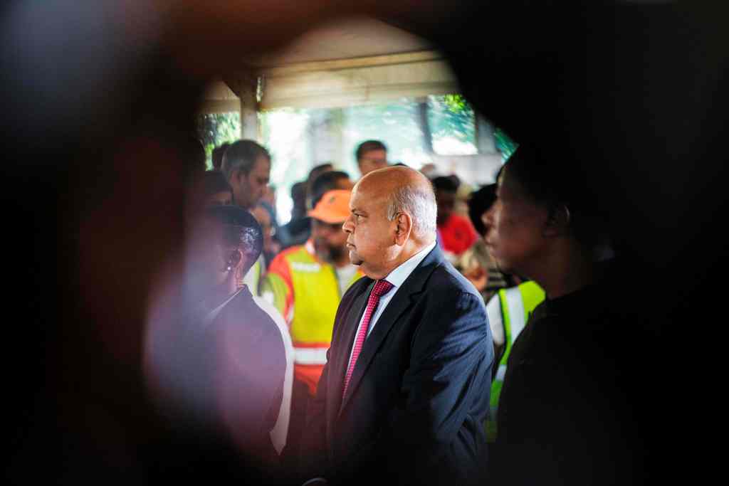 South African finance Minister Pravin Gordhan attends the funeral of late South African anti-apartheid activist Ahmed Kathrada at the Westpark Cemetery in Johannesburg, South Africa, on March 29, 2017. AFP / GIANLUIGI GUERCIA