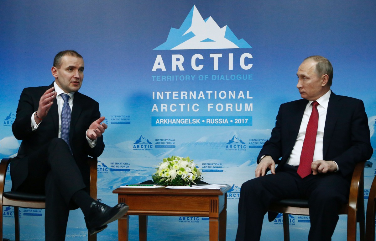 Russian President Vladimir Putin (R) speaks with President of Iceland Gudni Johannesson during the International Arctic Forum in Arkhangelsk on March 30, 2017.  AFP / Sergei Karpukhin