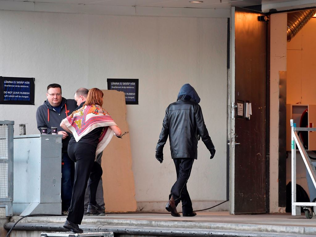 A person supposedly being the US artist Bob Dylan wearing a black jacket and a hoodie is photographed while entering the backstage door at Stockholm Waterfront April 1, 2017, where Bob Dylan is preforming the same night. There is no certain confirmation y