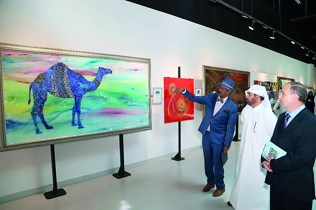 Malaysian-born artist Patric Rozario (left) and Katara General Manager Dr Khalid bin Ibrahim Al-Sulaiti (centre) at the opening of ‘Metals, Gems and Pearls’ exhibition at Katara.