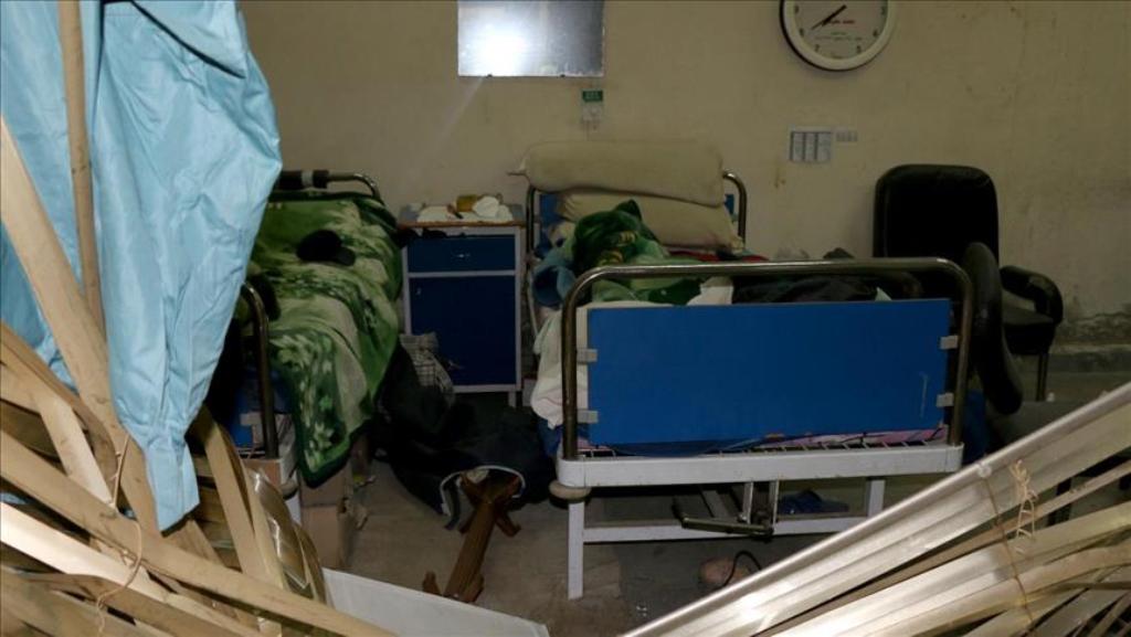 IDLIB, SYRIA - APRIL 2: Interior view of a damaged hospital is seen after airstrikes hit National hospital in Maret el Numan district of Idlib, Syria on April 2, 2017. ( Mesut Bessura - Anadolu Agency ).