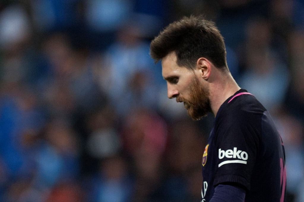 Barcelona's Argentinian forward Lionel Messi stands during the Spanish league football match Malaga CF vs FC Barcelona at La Rosaleda stadium in Malaga on April 8, 2017. / AFP / JORGE GUERRERO
