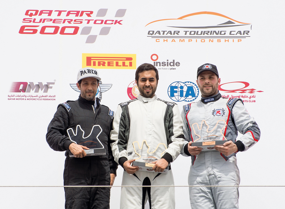 The podium winners at the Qatar Touring Car Championship (QTCC) pose for a picture at the Losail International Circuit. Abdulla Al Khelaifi won the first place, followed by Mahmoud Al Khalaf in the second spot, while Omran Karama came third.