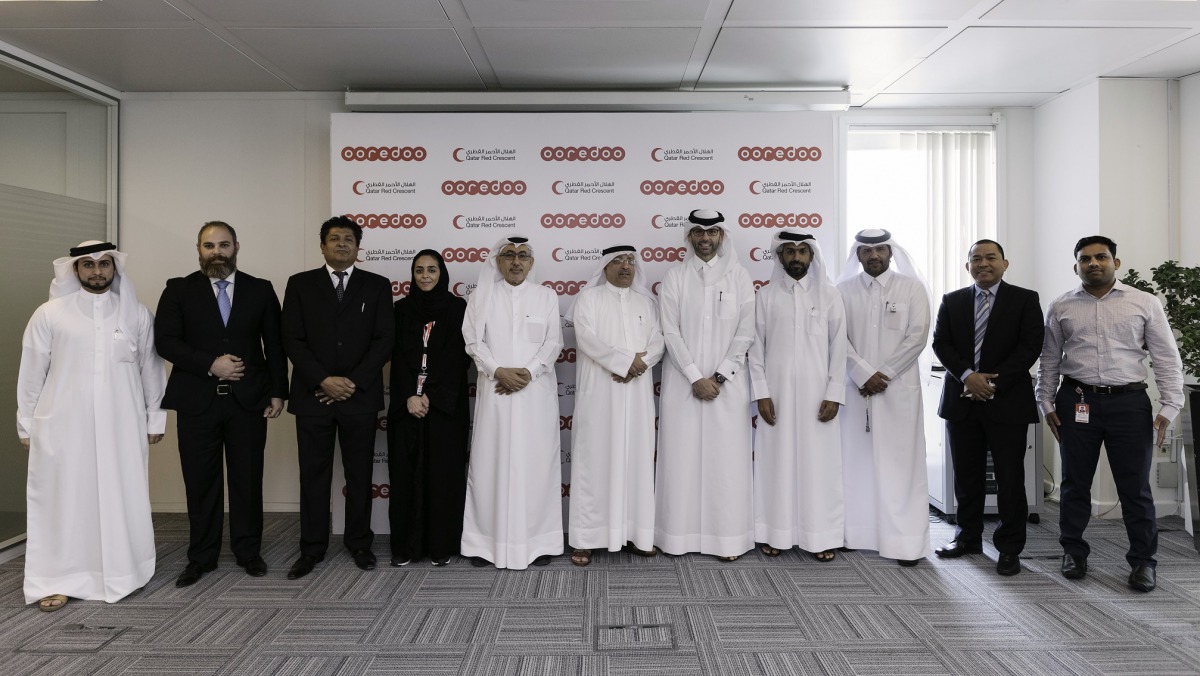 Ooredoo officials after signing the agreement.