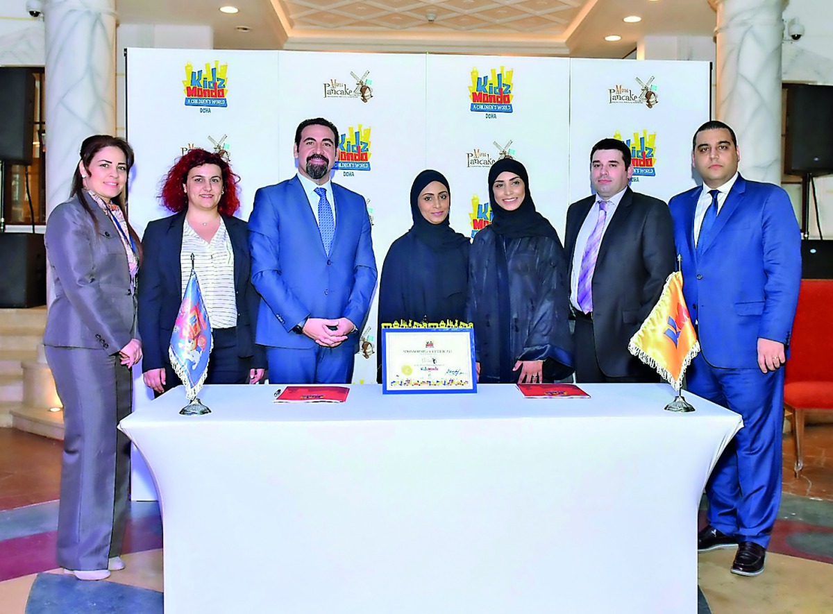 KidzMondo Doha and Mini Pancake officials at the partnership signing ceremony.