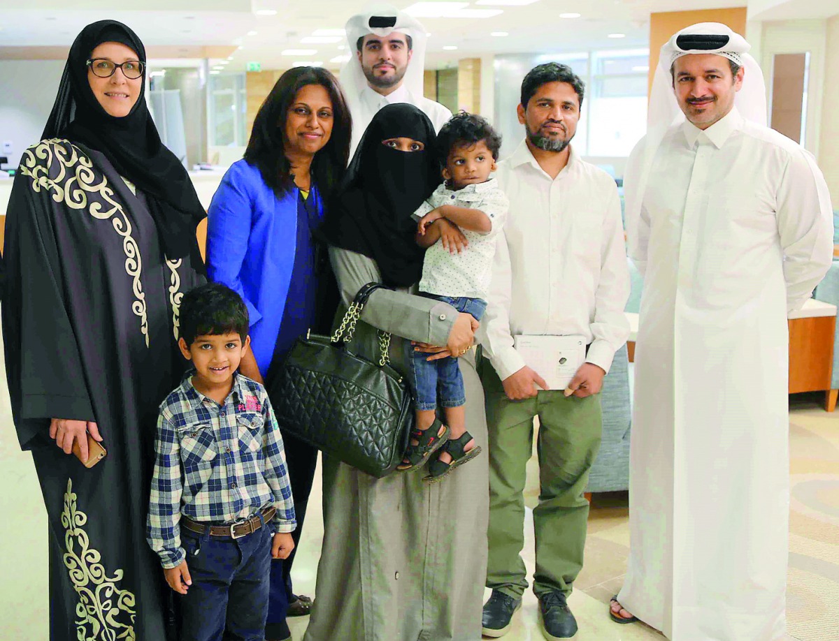 Osman and his family with members from Sidra.