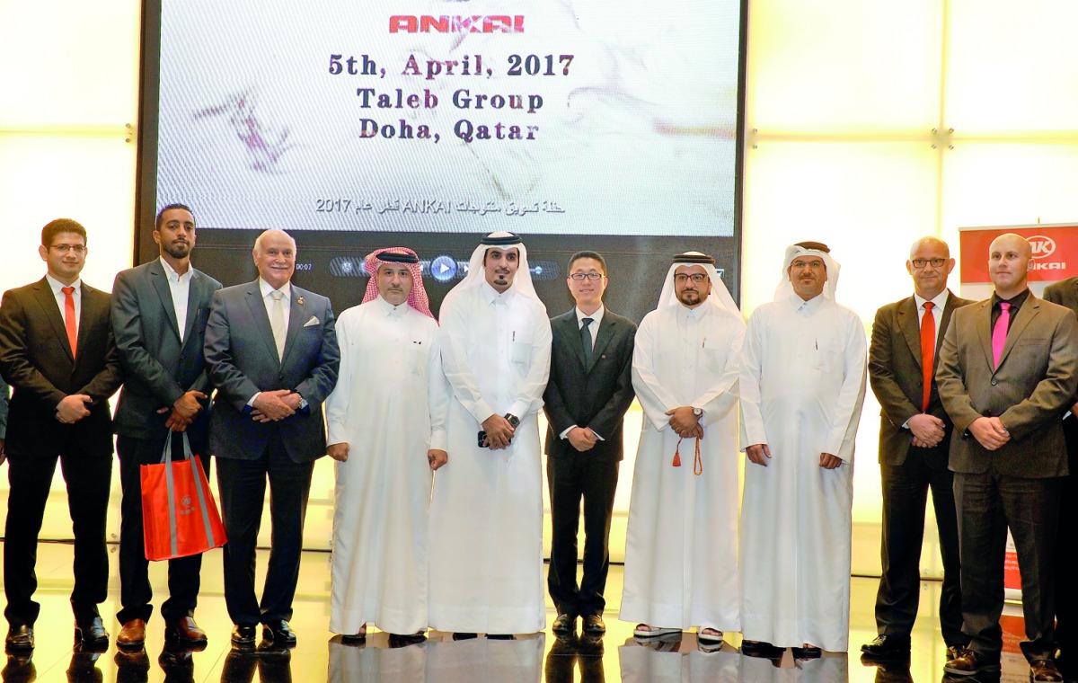 Mohammed Taleb Al Khauri (fourth left), Managing Director, Taleb Group, Tony Gu, (fifth right) Ankai International Regional Manager, Middle East, and other officials during the launch of Ankai bus at Taleb Trading Company. Pic: Kammutty VP / The Peninsula