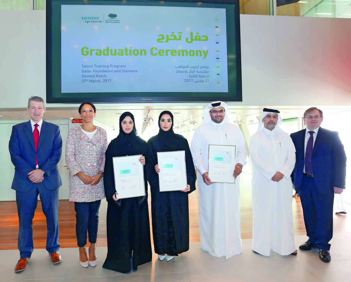 Qatar Foundation interns with officials.