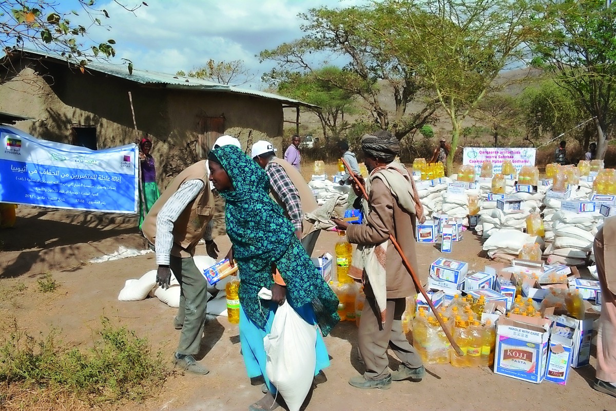 A woman carrying food provided by RAF at an aid distribution centre at a drought-affected village in Ethiopia.