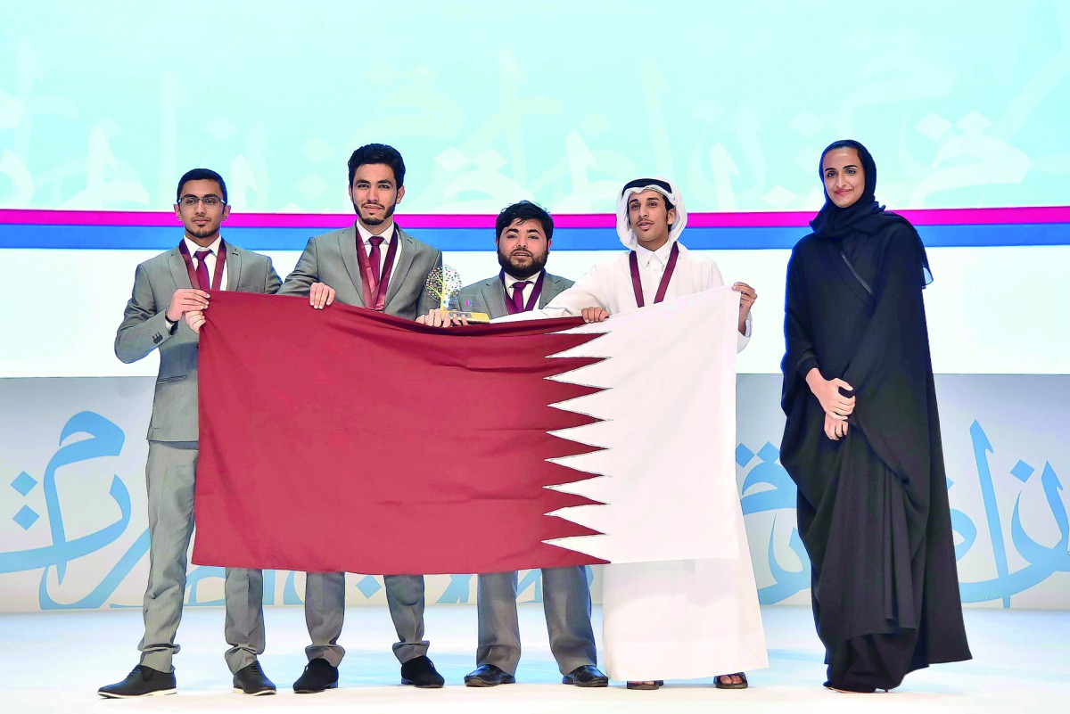 H E Sheikha Hind bint Hamad Al Thani with the Qatar University Team for boys who won the first place at fourth International Universities Arabic Debating Championship 2017 in Doha, yesterday. 