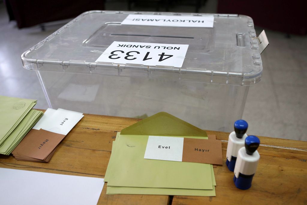 The urn is pictures as ballots with the words in Turkish that read, 'Evet' or 'Yes' and 'Hayir' or 'No', and stamps are prepared for people arriving at a polling station to vote in the referendum on expanding the powers of the Turkish president on April 1