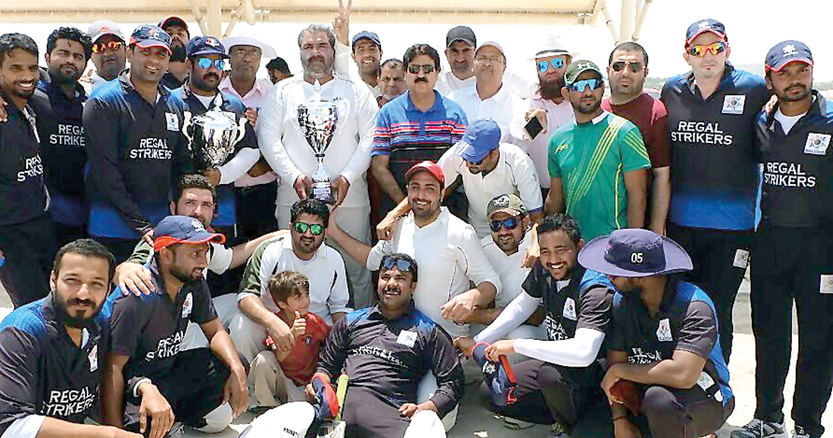 The players of Khetco XI  and Regal Strikers pose for a group photo following the final of Qatar Airways Twenty20 Tournament at West Bay Gound recently.  