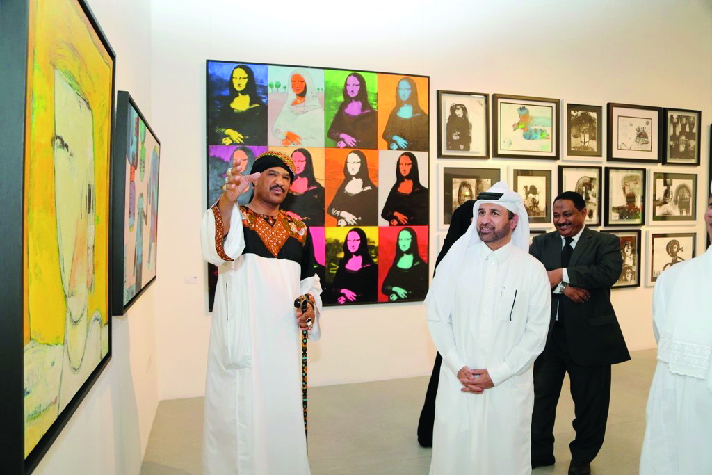 Sudanese artist Islam Kamel and Katara General Manager Dr Khalid bin Ibrahim Al Sulaiti at the launch of ‘Language of Silence’ at Katara Art Centre.