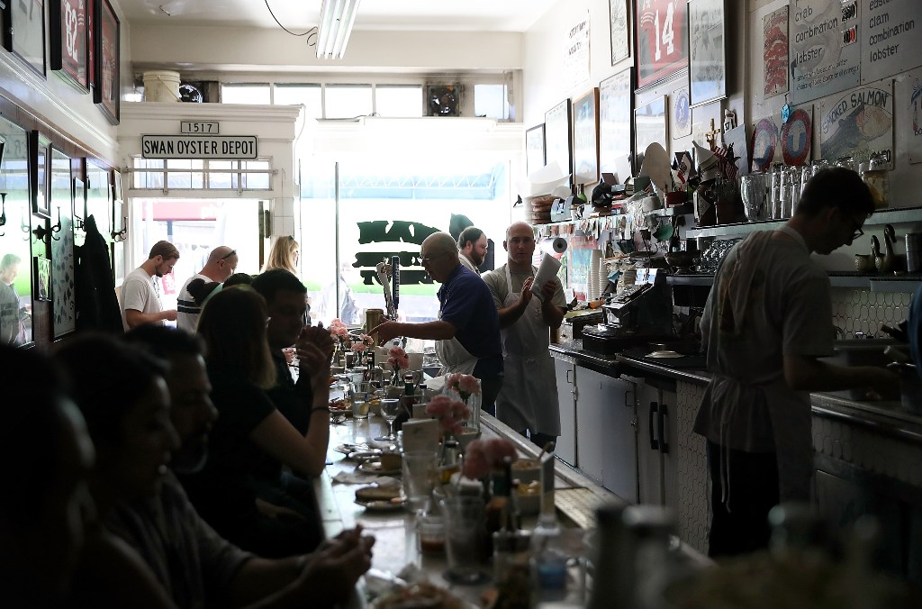 Swan Oyster Depot patrons sit in the dark during a citywide power outage on April 21, 2017 in San Francisco, California. Justin Sullivan/AFP
