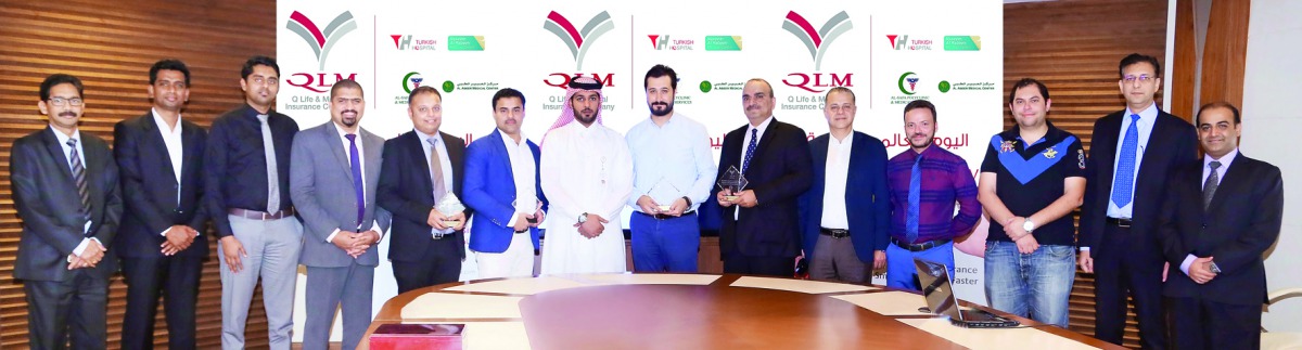 Salem Al Mannai, Deputy Group President & CEO of QIC Mena region, and other officials with representatives from Turkish Hospital, Al Safa Clinic, Abeer Clinic and Naseem Al Rabeeh Clinic, who were honoured at the event.