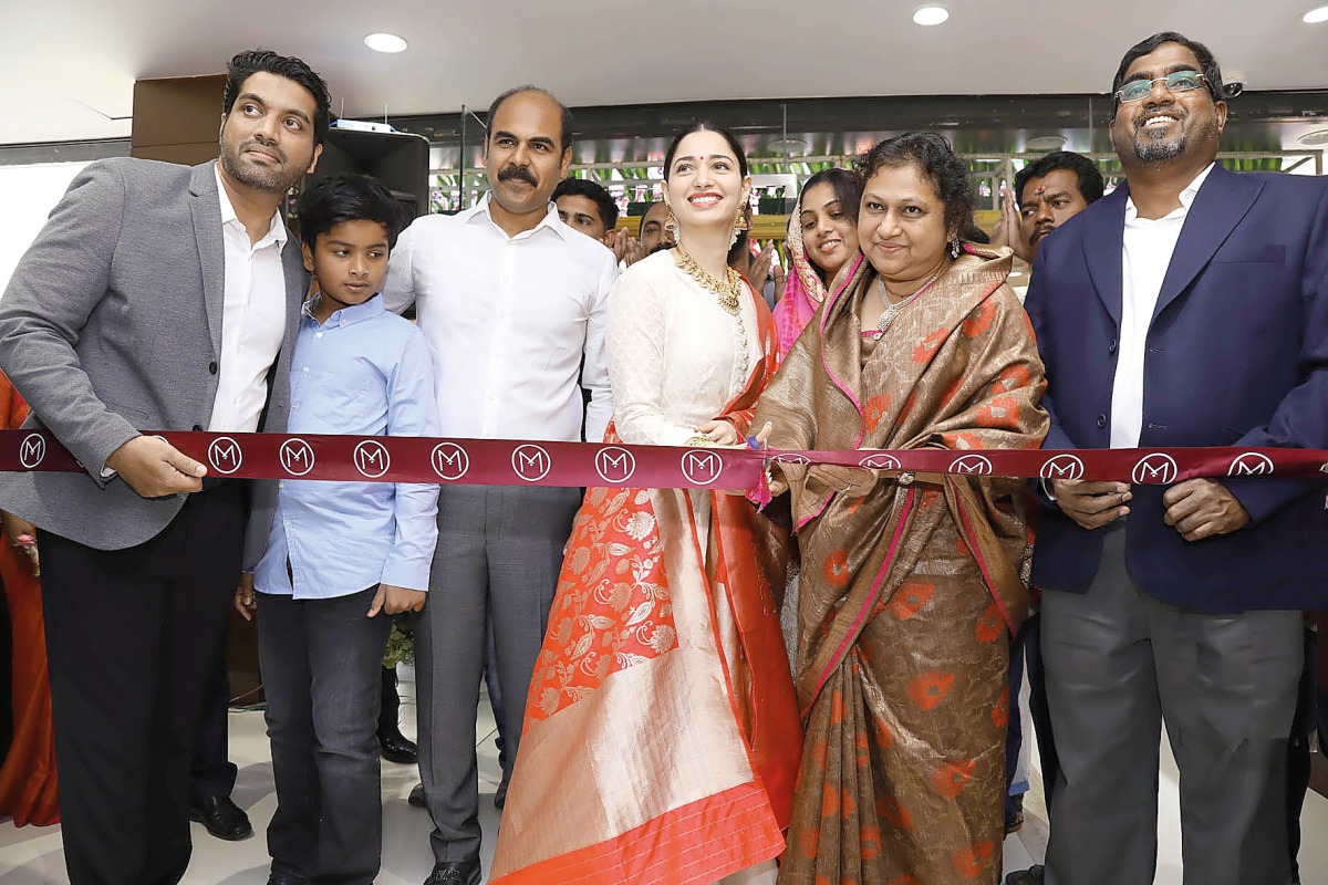 Bollywood actress Tamannaah Bhatia (fourth left) and Malabar Group Chairman- M P Ahammed’s wife Subaida K P jointly inaugurating the 175th showroom of Malabar Gold & Diamonds in presence of senior officials in Tamil Nadu, India.