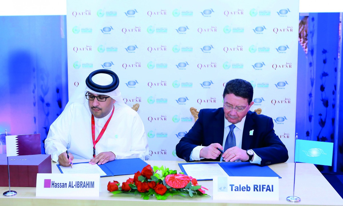 Hassan Al Ibrahim, Chief Tourism Development Officer at QTA, and Taleb Al Rifai, Secretary-General of UNWTO, signing the agreement.