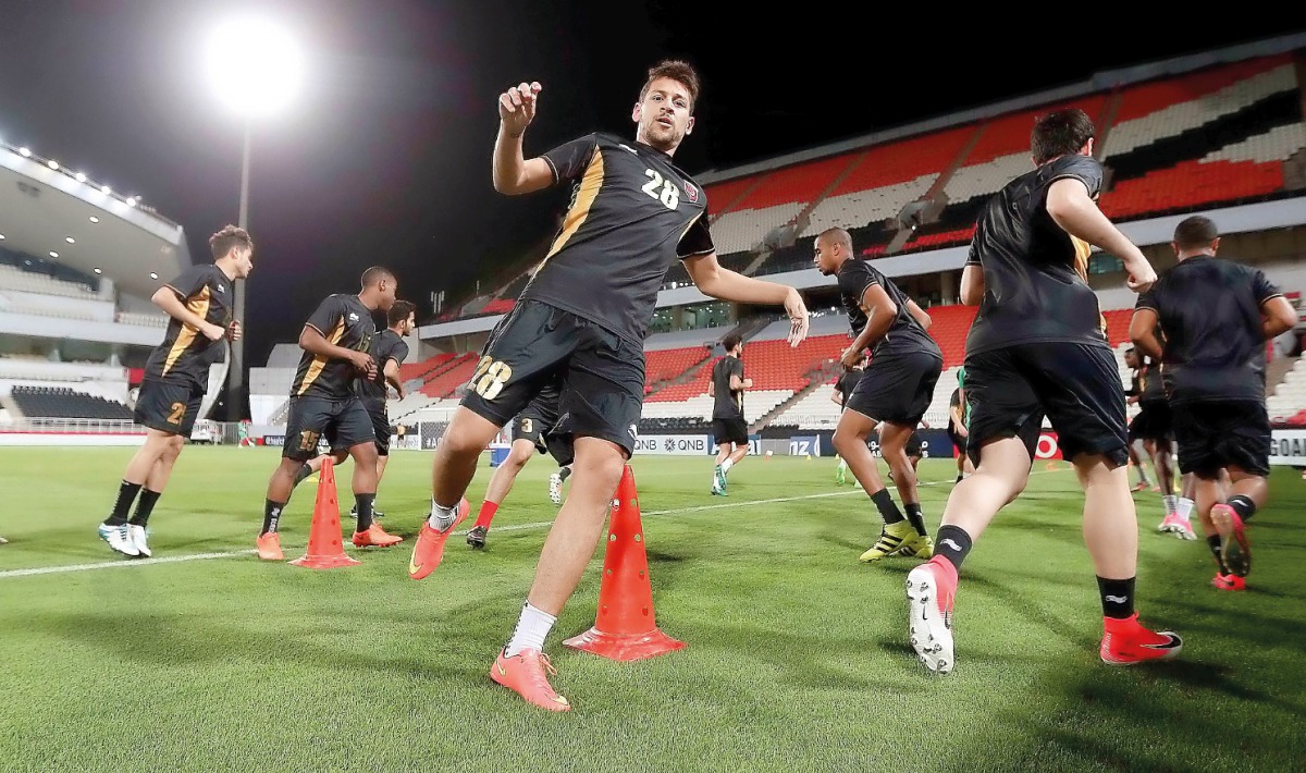 Lekhwiya players in action during a practice session on the eve of their AFC Champions League match against UAE's Al Jazira. INSET: TOP - Lekhwiya coach Djamel Belmadi sepaks to media during a press conference held yesterday.