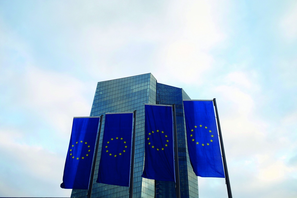 EU flags fly in front of European Central Bank headquarters in Frankfurt.
