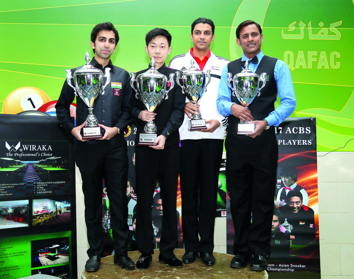 India's Pankaj Advani (left), runner-up at the Asian Snooker Championship poses for a picture with winner Lv Haotian of China and the two losing semi-finalists Mohammad Bilal (right) of Pakistan and Mohamed Shehab of UAE after the medal ceremony in Doha y