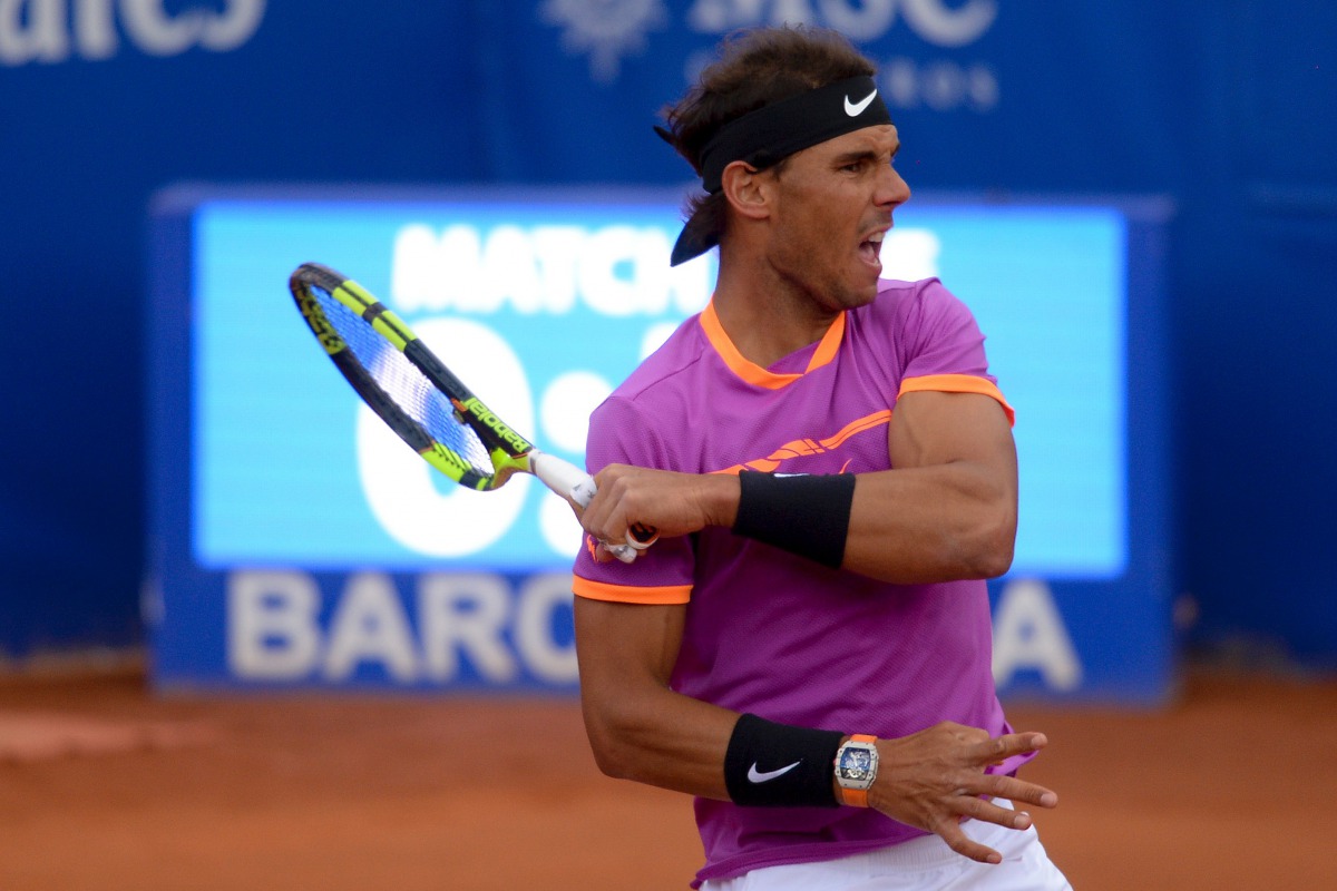 Spanish tennis player Rafael Nadal returns the ball to Argentinian tennis player Horacio Zeballos during the ATP Barcelona Open 