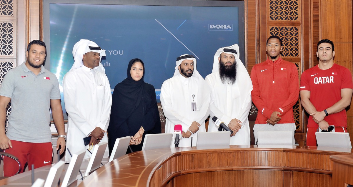 The General Secretary of Qatar Athletics Federation (QAF) Mohammed Issa Al Fadala (centre), Assistant Director of National and Board Member of QAF, Khalid Rashid Al Marri (third right), retired Qatari sprinter Talal Mansour (second left), and other Qatari