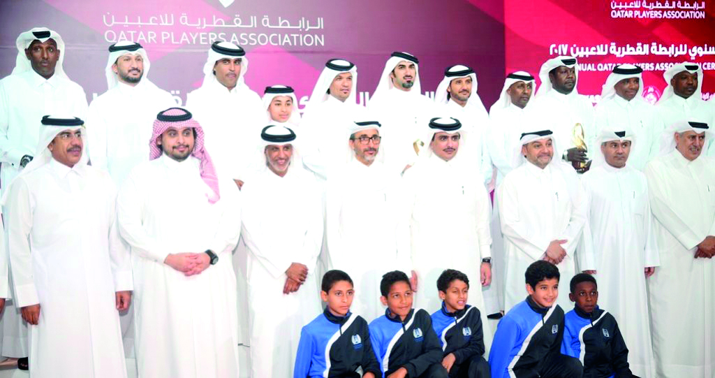 Qatar's Minister of Culture and Sports H E Salah bin Ghanem Al Thani and Qatar Football Association (QFA) President Sheikh Hamad bin Khalifa bin Ahmed Al Thani pose with former Qatari footballers at Qatar's Players' Association (QPA) ceremony on Monday in