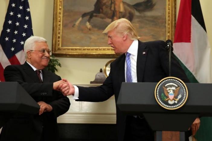 US President Donald Trump shakes hands with Palestinian President Mahmoud Abbas as they deliver a statement at the White House in Washington DC, US, May 3, 2017. REUTERS/Carlos Barria