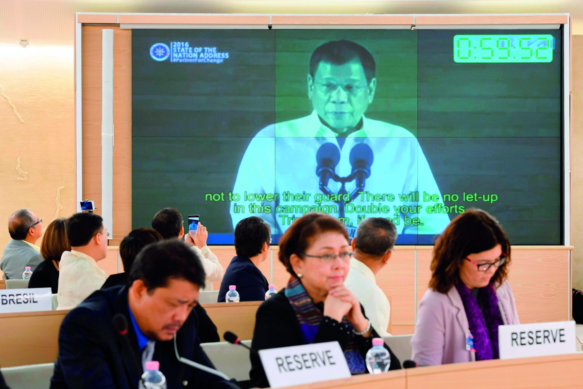Philippine President Rodrigo Duterte delivers a speech shown on a screen during the universal periodic review of the Philippines by the Office of the United Nations High Commissioner for Human Rights, in Geneva, yesterday.
