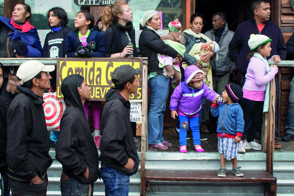 Migrants seeking for asylum in the United States await near the US-Mexico border at El Chaparral crossing in Tijuana, Mexico on May 7, 2017. The caravan of Central American people seeking for refuge in the United States started their march past April on t