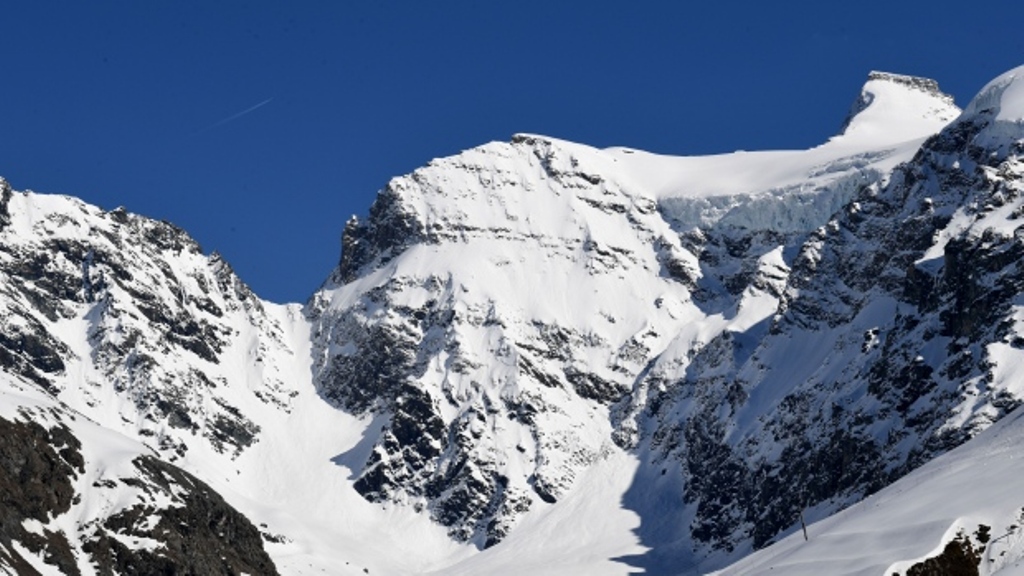 A picture taken from Bonneval-sur-Arc on May 9, 2017 shows the Greffier pass in the Albaron area in the French Alps, near the Italian border, where two skiers and their guide was killed by a late-season avalanche. Jean-Pierre Clatot/AFP.