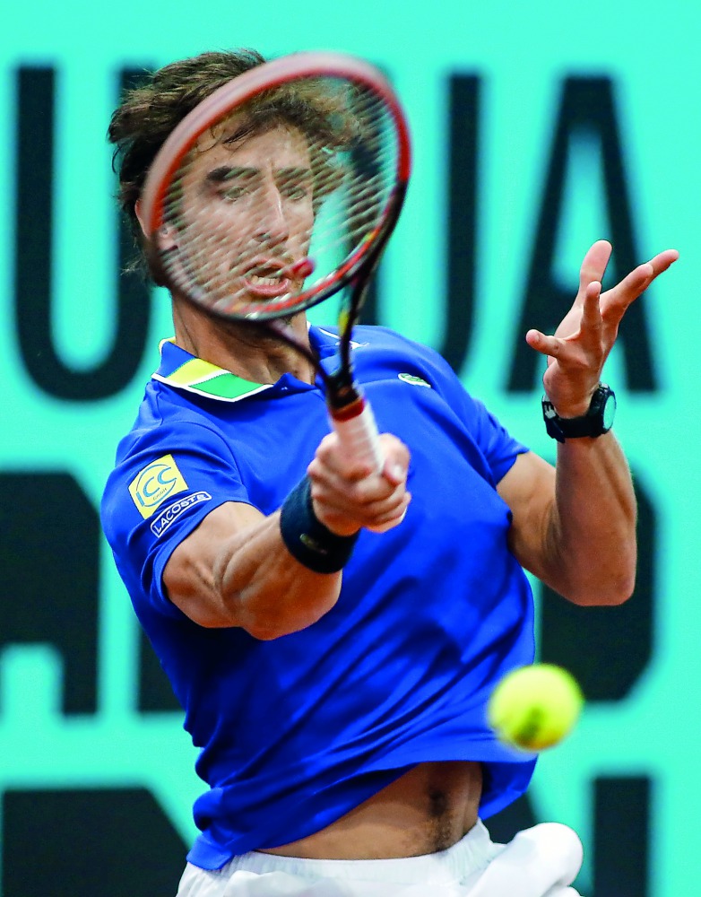 Pablo Cuevas of Uruguay returns the ball to Alexander Zverev of Germany during the ATP Madrid Open quarter-final match in Madrid, yesterday. Cuevas won 3-6, 6-0 and 6-4.