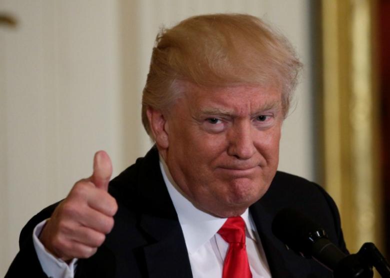 U.S. President Donald Trump gestures while attending a “celebration of military mothers'' at the White House in Washington, U.S., May 12, 2017. REUTERS/Kevin Lamarque
