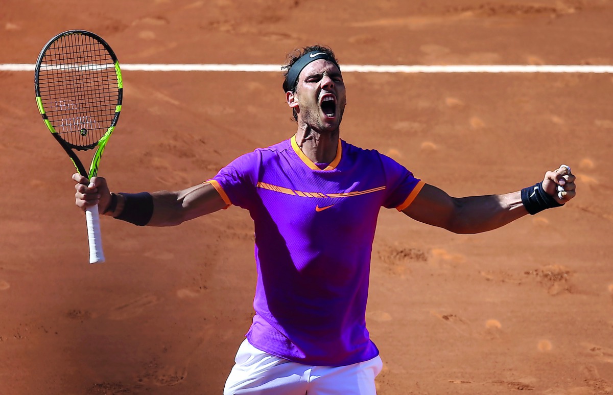 Rafael Nadal of Spain celebrates his victory over Novak Djokovic of Serbia after their Madrid Open semi-final in Madrid.