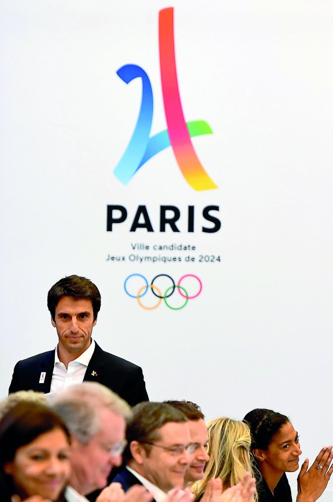 Co-president of the Paris bid for the 2024 Olympics Tony Estanguet (back) attends the IOC Evaluation Commission session for the 2024 Olympic Games in Paris. 
