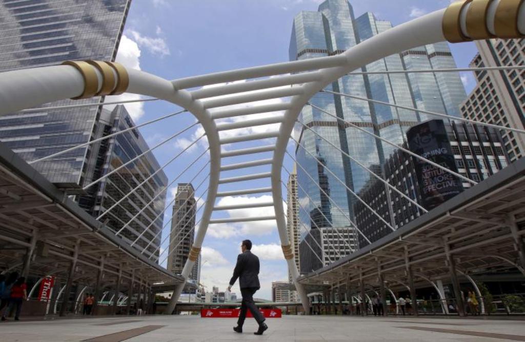 FILE PHOTO: A man walks in business area in Bangkok, Thailand, May 22, 2015. REUTERS/Chaiwat Subprasom/File Photo.