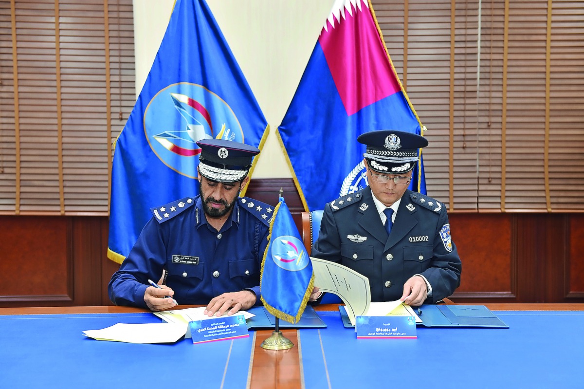 Director General of the Police College, Brigadier Dr Mohammad Abdullah Al Mohanna, and Director of Police College of Fujian, Lauroy Rong, signing the agreement.