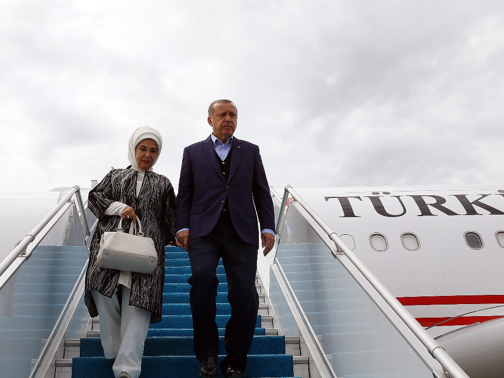 President of Turkey Recep Tayyip Erdogan (R) and his wife Emine Erdogan (L) leave the private plane called 