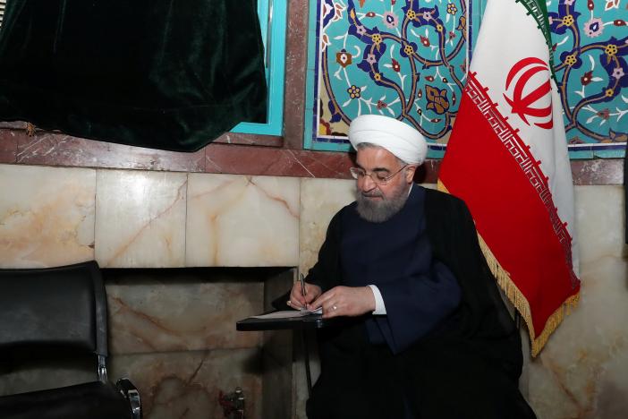 Iran's President Hassan Rouhani fills in his ballot as he votes during the presidential election in Tehran, Iran, May 19, 2017. President.ir/Handout via REUTERS

