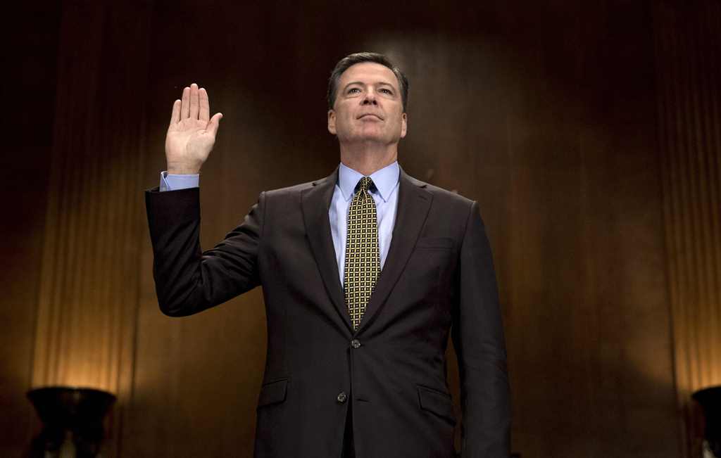(FILES) This file photo taken on May 03, 2017 shows then FBI Director James Comey being sworn in prior to testifying before the Senate Judiciary Committee on Capitol Hill in Washington, DC. AFP / JIM WATSON